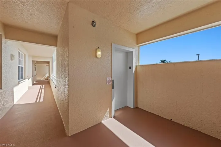 View of exterior entry featuring stucco siding