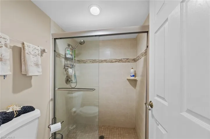 Bathroom with toilet and a shower stall