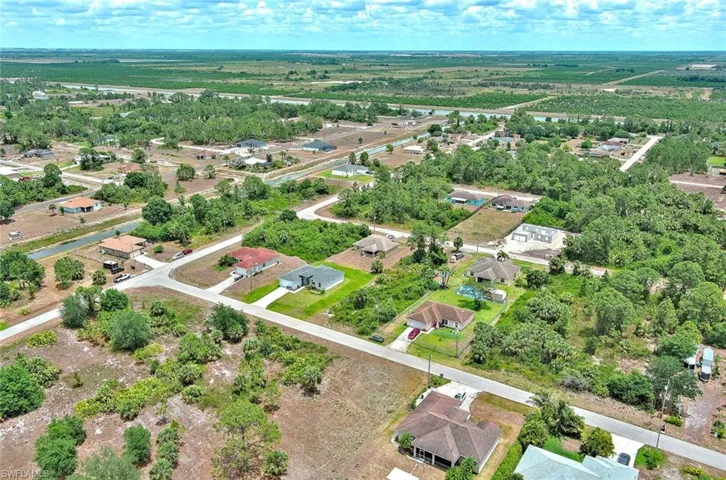 Aerial overview of property's location with nearby suburban area