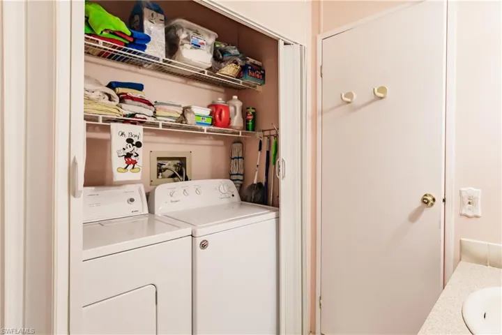 Laundry room with washing machine and clothes dryer