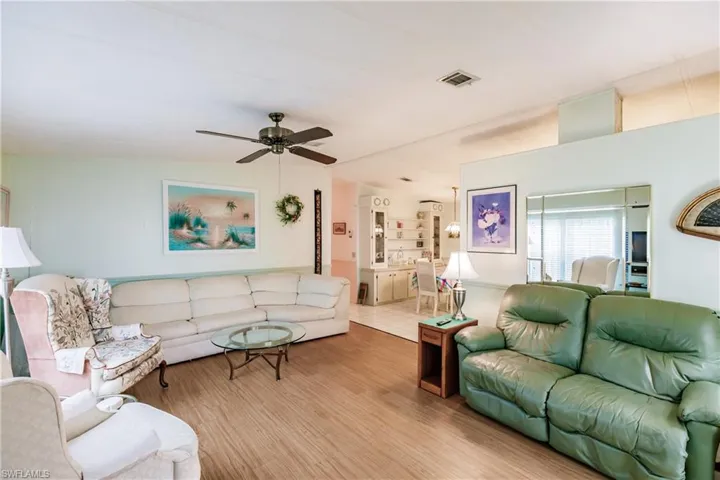 Tiled living room with ceiling fan