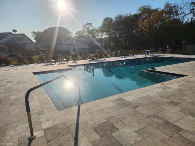 Community pool featuring a patio area