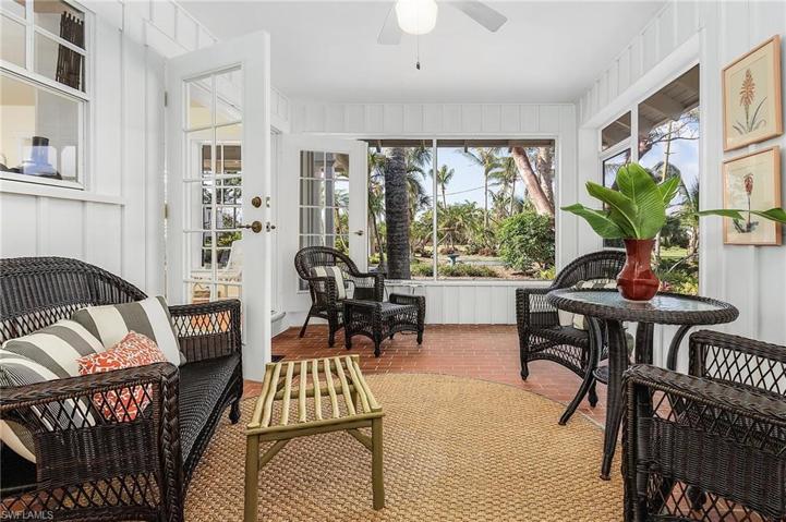 Screened breezeway between main house and apartment