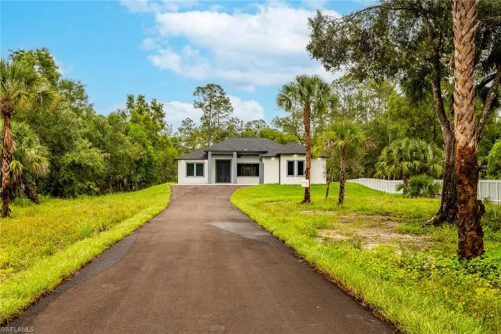 Ranch-style home with a front lawn