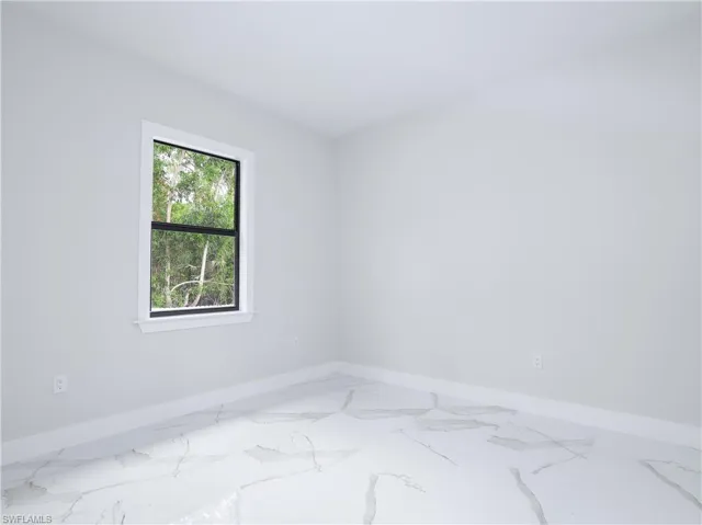 Unfurnished room with tile patterned floors