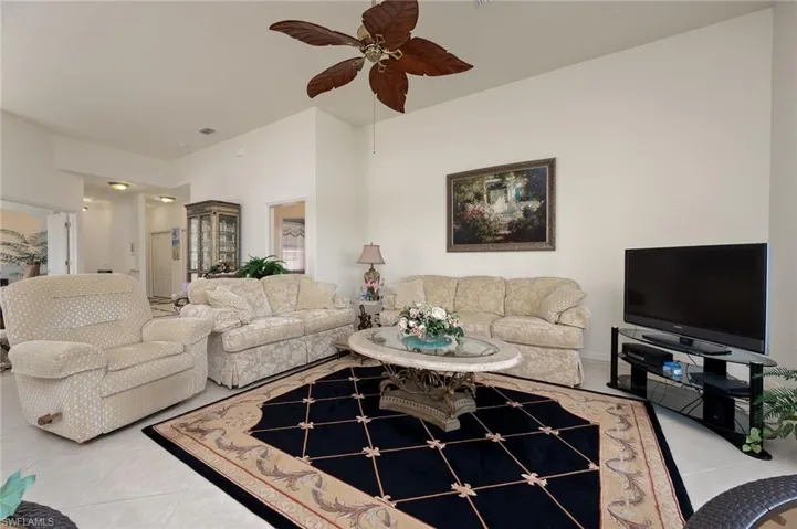 Tiled living room with ceiling fan