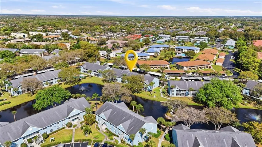 Aerial view of property's location featuring nearby suburban area