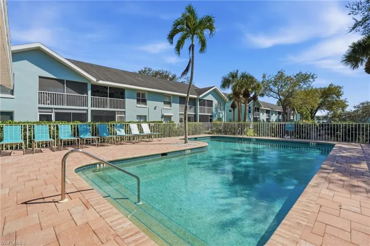 Community pool with a patio area