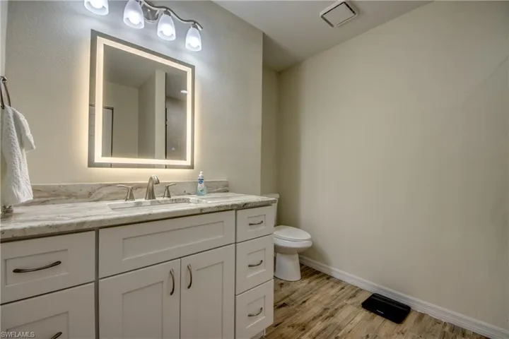 Bathroom with vanity and light wood-style floors