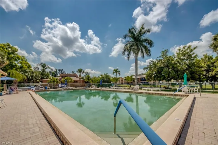Community pool featuring a patio area