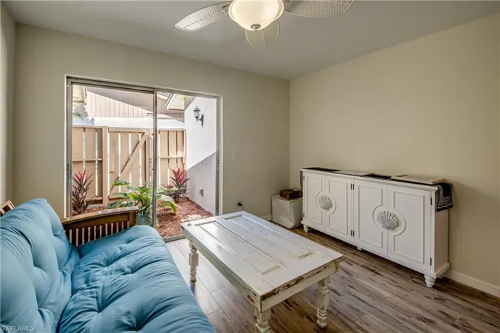 Living area featuring wood finished floors and baseboards