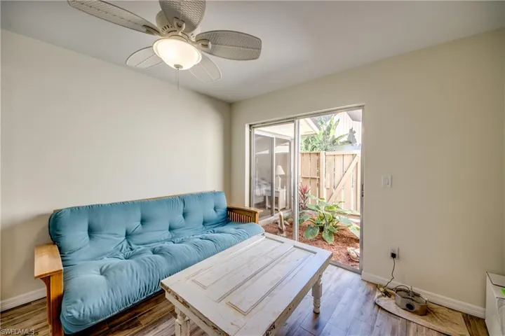 Living area featuring wood finished floors and ceiling fan