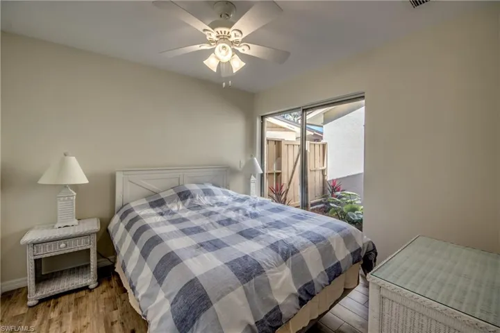 Bedroom featuring wood finished floors and a ceiling fan