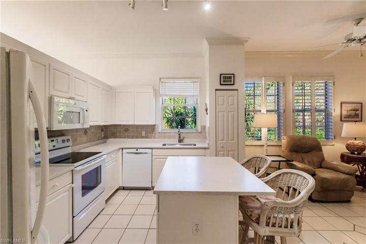 Bright and white Kitchen with mid island.