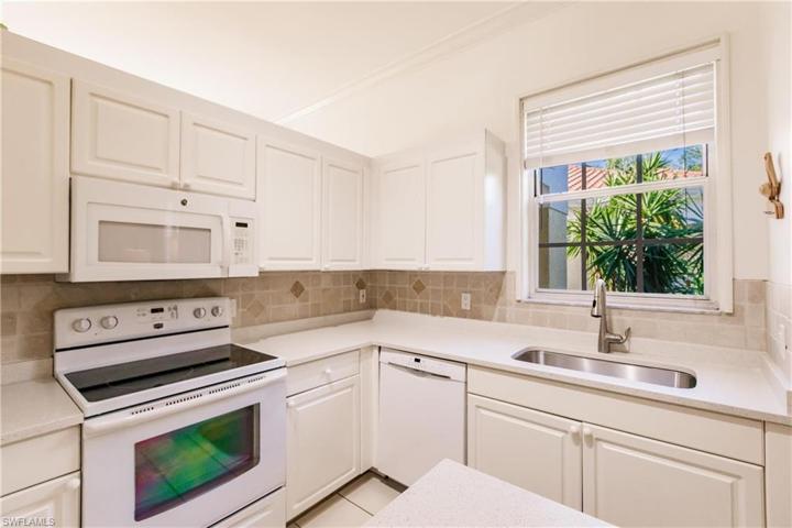 Hard surface counter tops and plenty of cabinet space.
