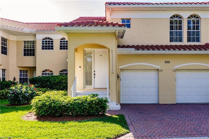 Front of unit with attached garage.