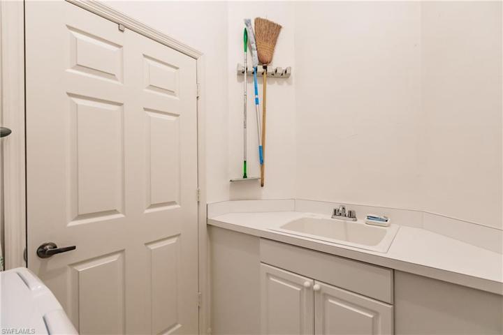 Laundry sink with additional cabinet/counter space.