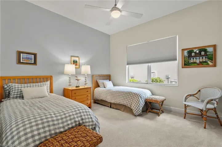 Bedroom with light carpet and ceiling fan