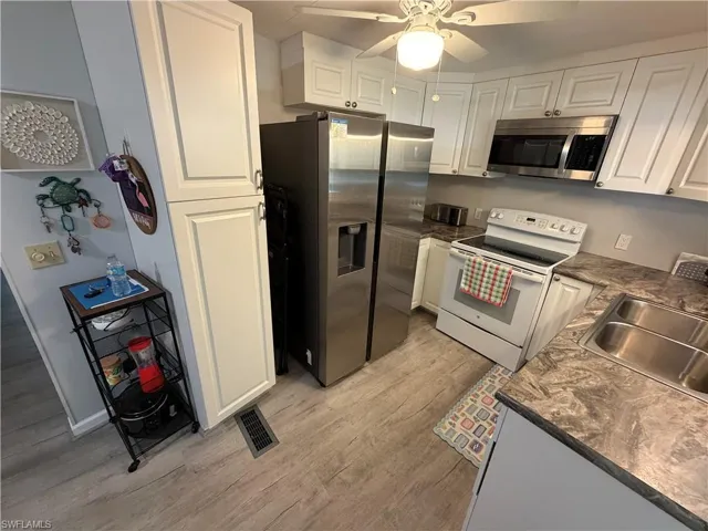 Kitchen with Refrigerator, Stove Pantries & Microwave