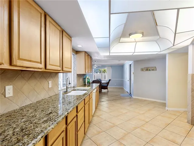 Kitchen with wood cabinets and granite counters