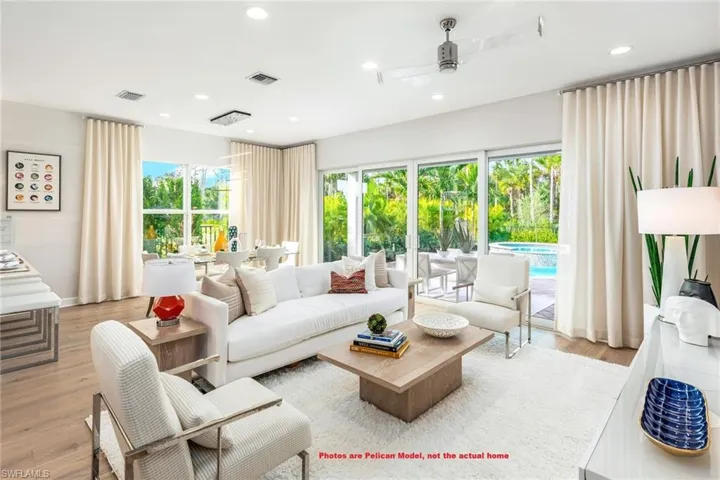 Living room featuring light hardwood / wood-style flooring and ceiling fan