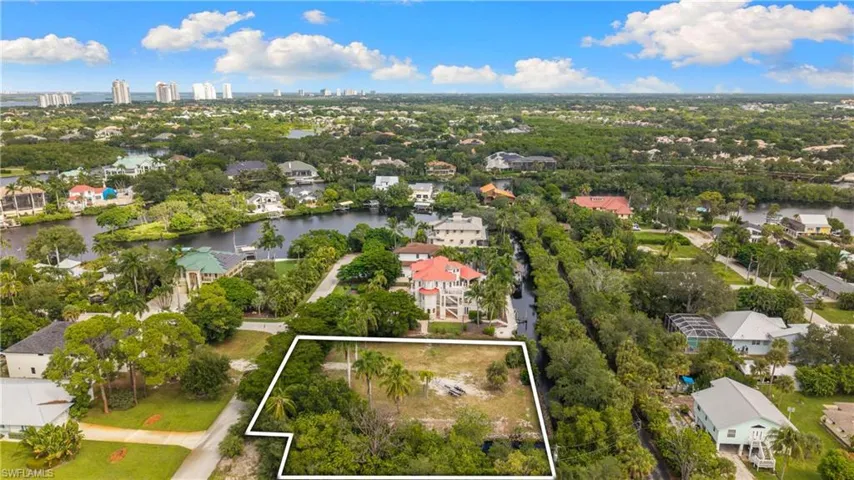 Expansive lot featuring mature trees within a developed residential area