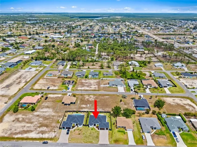 Aerial overview of property's location with nearby suburban area