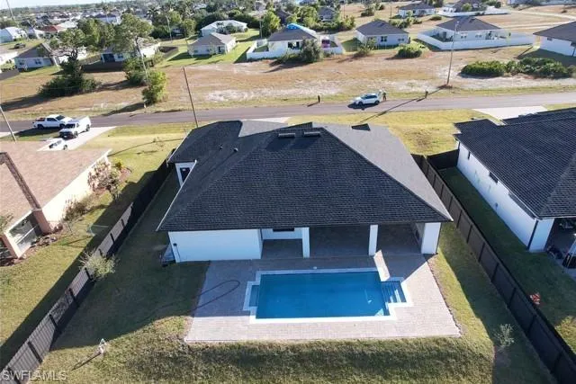 Aerial view of residential area with a pool