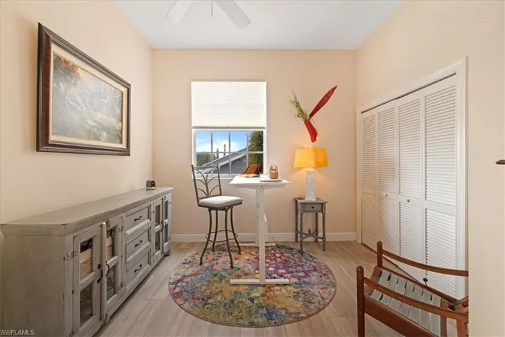 Sitting room with ceiling fan and light hardwood / wood-style floors