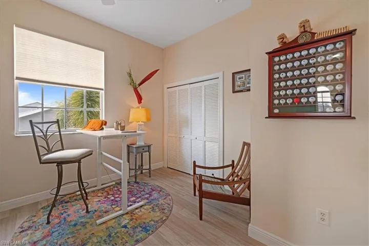 Office area with light hardwood / wood-style flooring