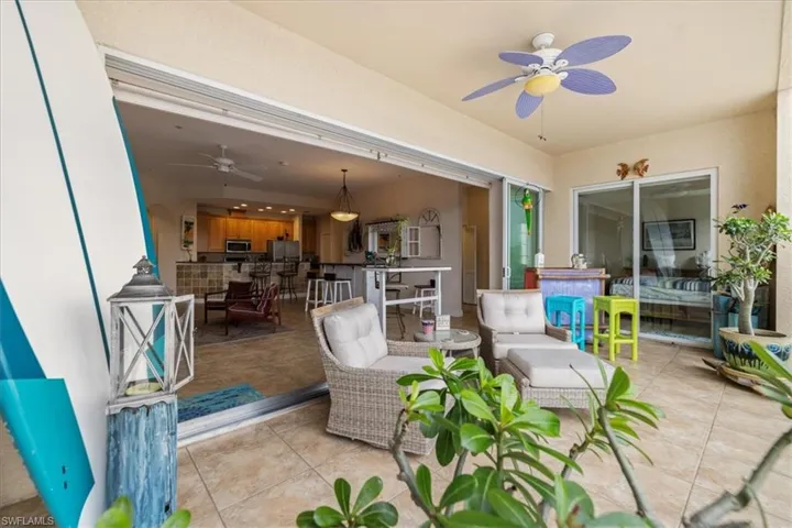 View of patio / terrace featuring ceiling fan, an outdoor hangout area, and an outdoor bar