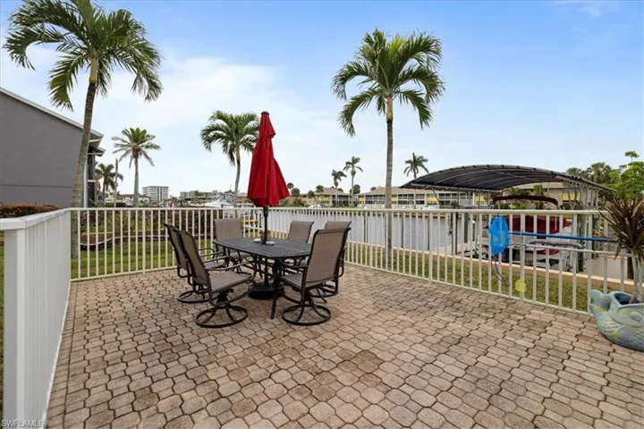 View of patio with a water view