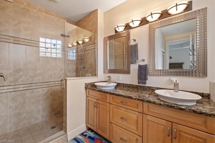 Bathroom with vanity and walk in shower