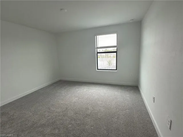 Unfurnished room featuring carpet floors