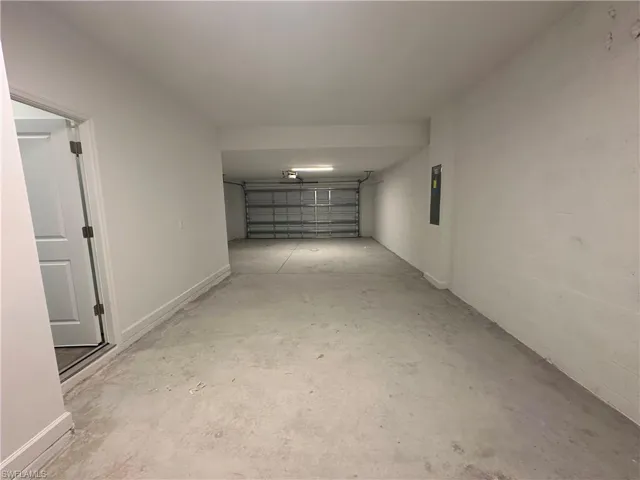 Garage featuring electric panel