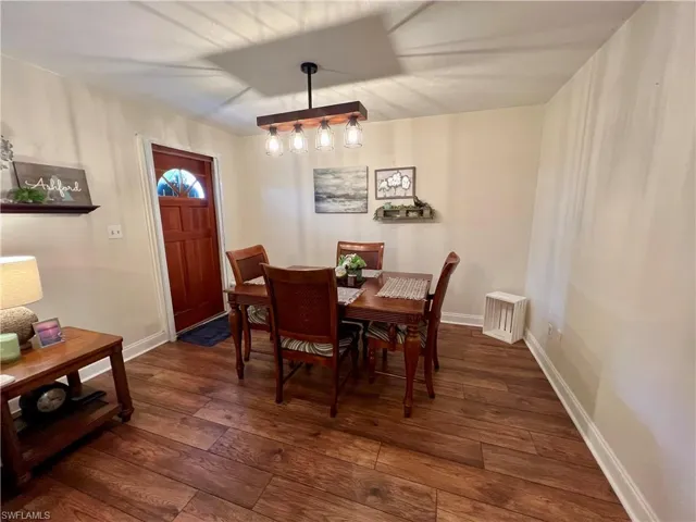 Dining area with luxury vinyl plank flooring.