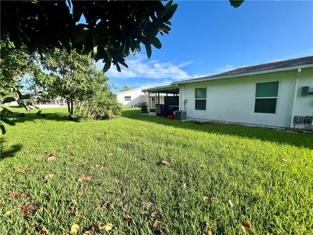 View of yard with central AC