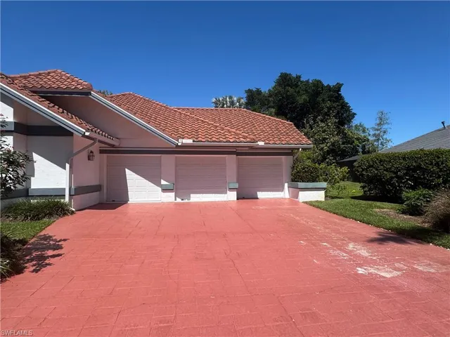 SE corner of home with 3-bay garage, discretely connecting to the separate 2-bay entrance on the other side of the home on the SW corner.