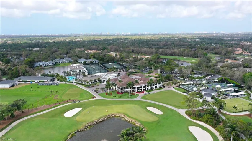 Bird's eye view featuring golf course view and a water view