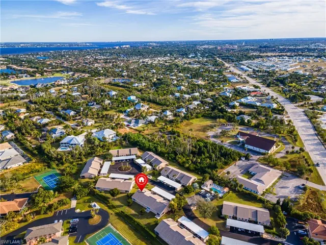 Aerial overview of property's location with nearby suburban area