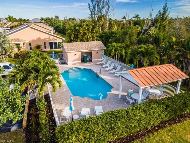 View of pool with a patio area and an outbuilding