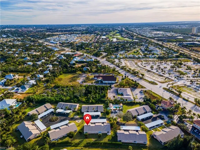Aerial view of property and surrounding area with future site of Calusa Grande