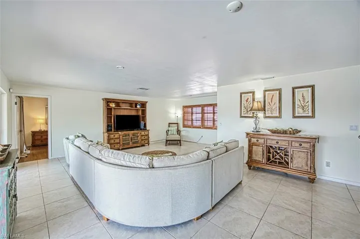 Living room featuring light tile flooring