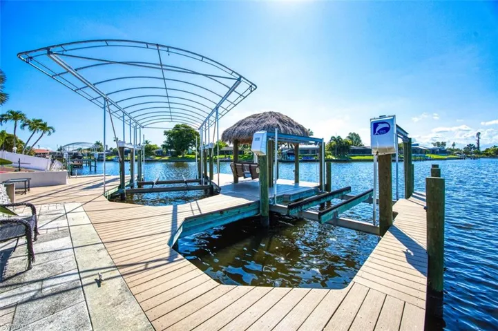 Dock area featuring a water view