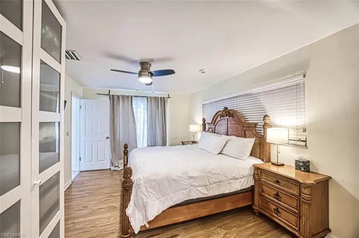 Bedroom featuring hardwood / wood-style floors and ceiling fan