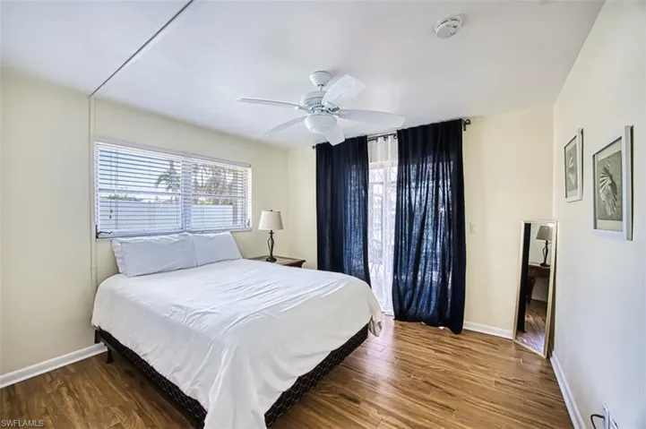 Bedroom featuring hardwood / wood-style floors and ceiling fan