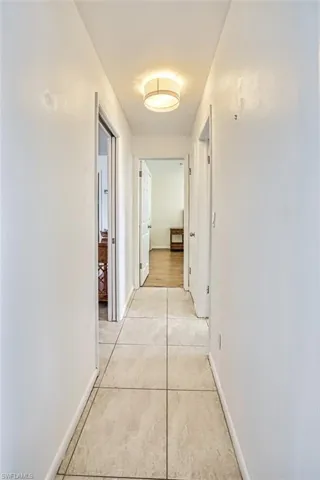 Corridor with light tile floors