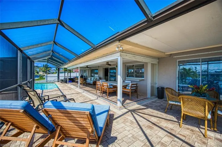 Sunroom featuring lofted ceiling