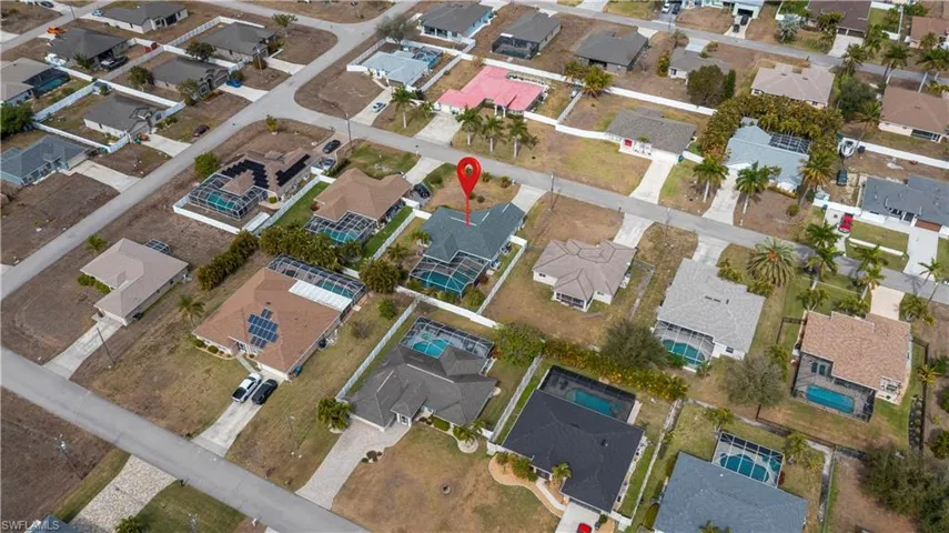 Aerial overview of property's location with nearby suburban area