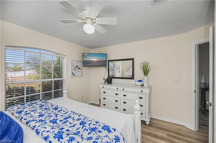 Bedroom featuring light wood-style floors and a ceiling fan